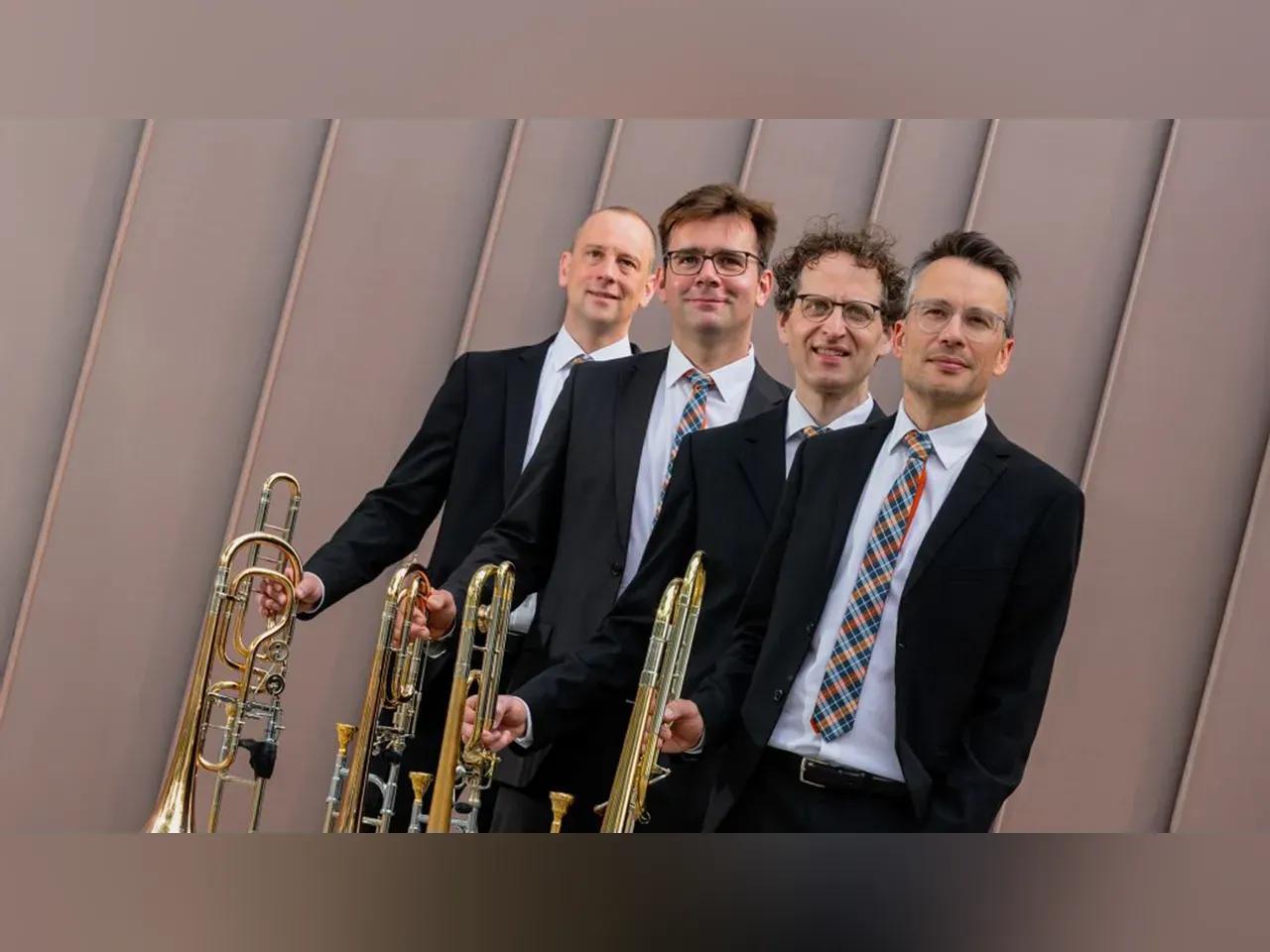 Frontalaufnahme der vier Musiker des Quadriga Posaunenquartetts